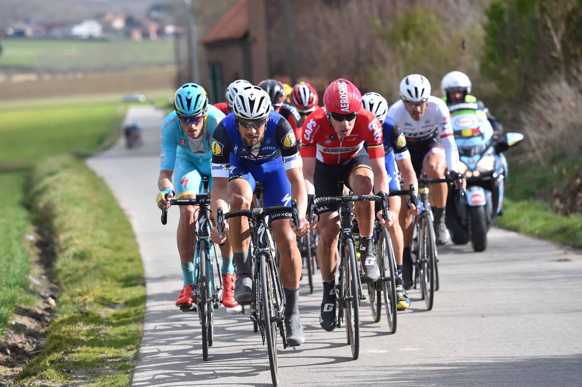 The Etixx-Quickstep team drives the pace in the lead split