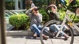 Photographers taking pictures on the street in the summer