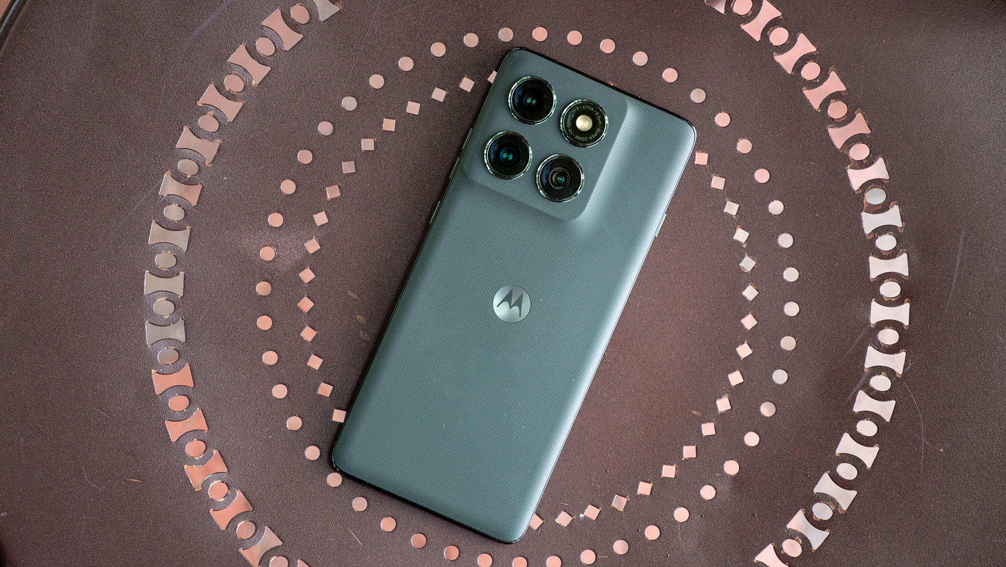 The vegan leather back of the forest green Motorola Edge 2025 
