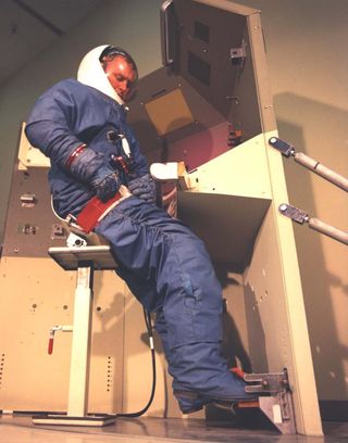 An astronaut workstation in the MOL laboratory module mock-up. The MOL astronauts would peer through a spotting scope at potential targets on the ground while directing a powerful telescope/camera to take high-resolution photographs.