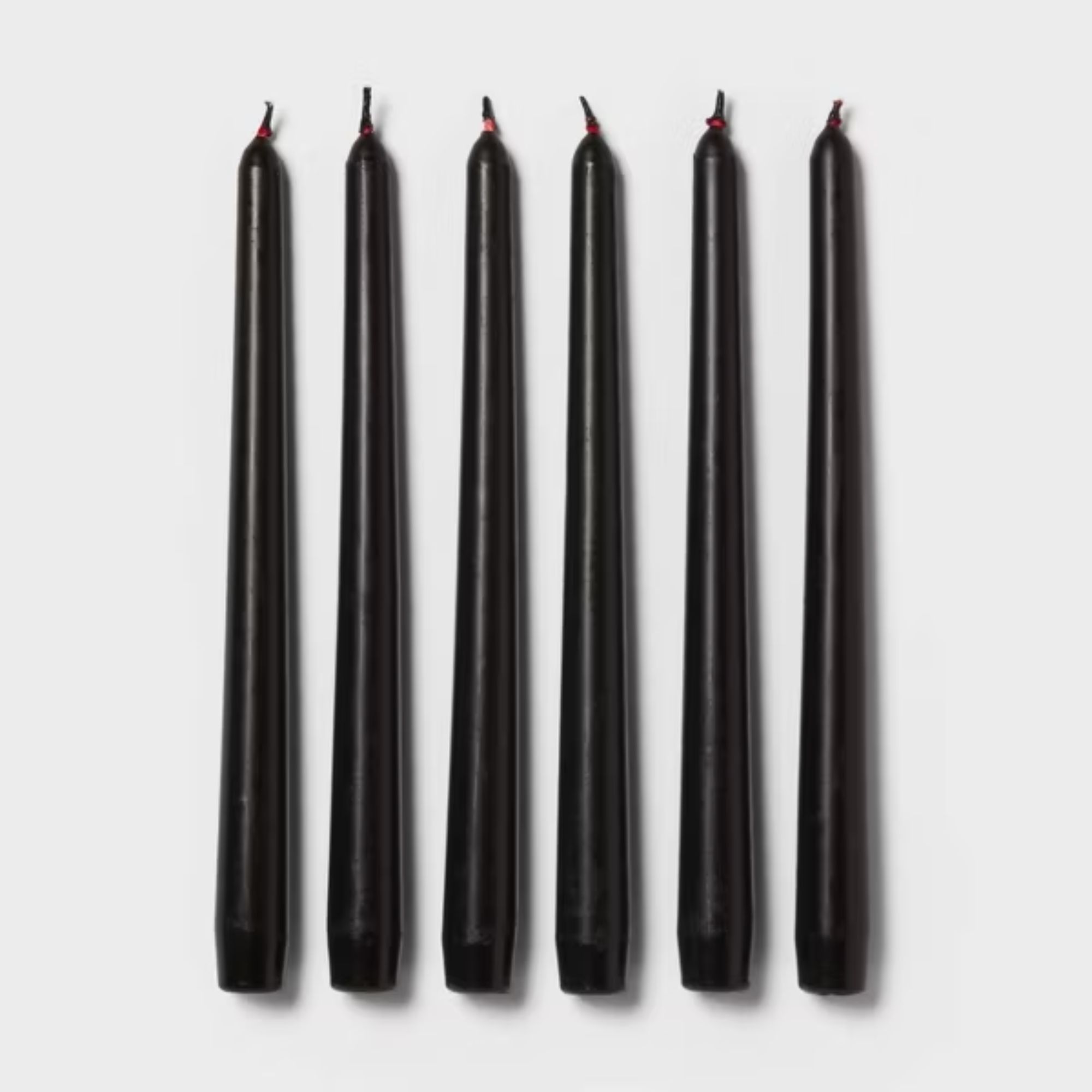 Six burgundy taper candles