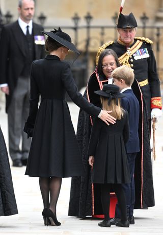 Catherine, Princess of Wales, Princess Charlotte of Wales and Prince George of Wales arrive at Westminster Abbey for The State Funeral of Queen Elizabeth II on September 19, 2022 in London, England.