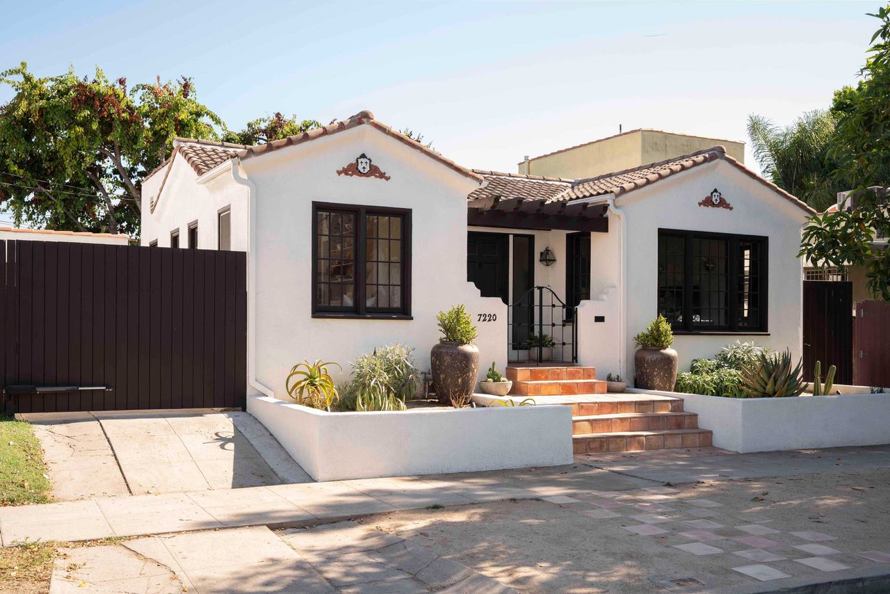 the exterior of a spanish bungalow