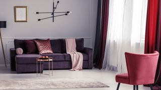 Living room with burgundy curtains