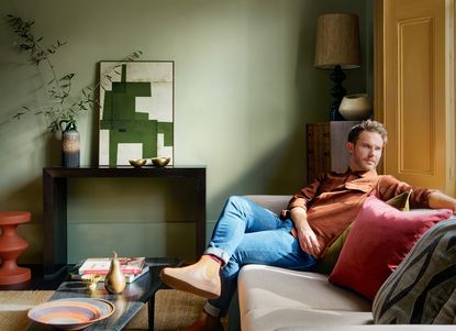 interior designer christian bense in a green and yellow living room