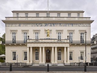 The Athenaeum - Waterloo Place - London SW1. The east front, with its gold figure of Athena by Edward Hodges Baily erected in 1830. Above is a copy of the Parthenon frieze, picked out in Wedgwood blue. Photograph: Will Pryce/Country Life Picture Library.