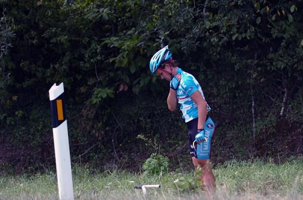 Linus Gerdemann (Team Milram) checks for injuries after crashing with Andy Schleck.
