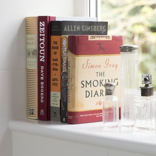 books with white wall and glass wall