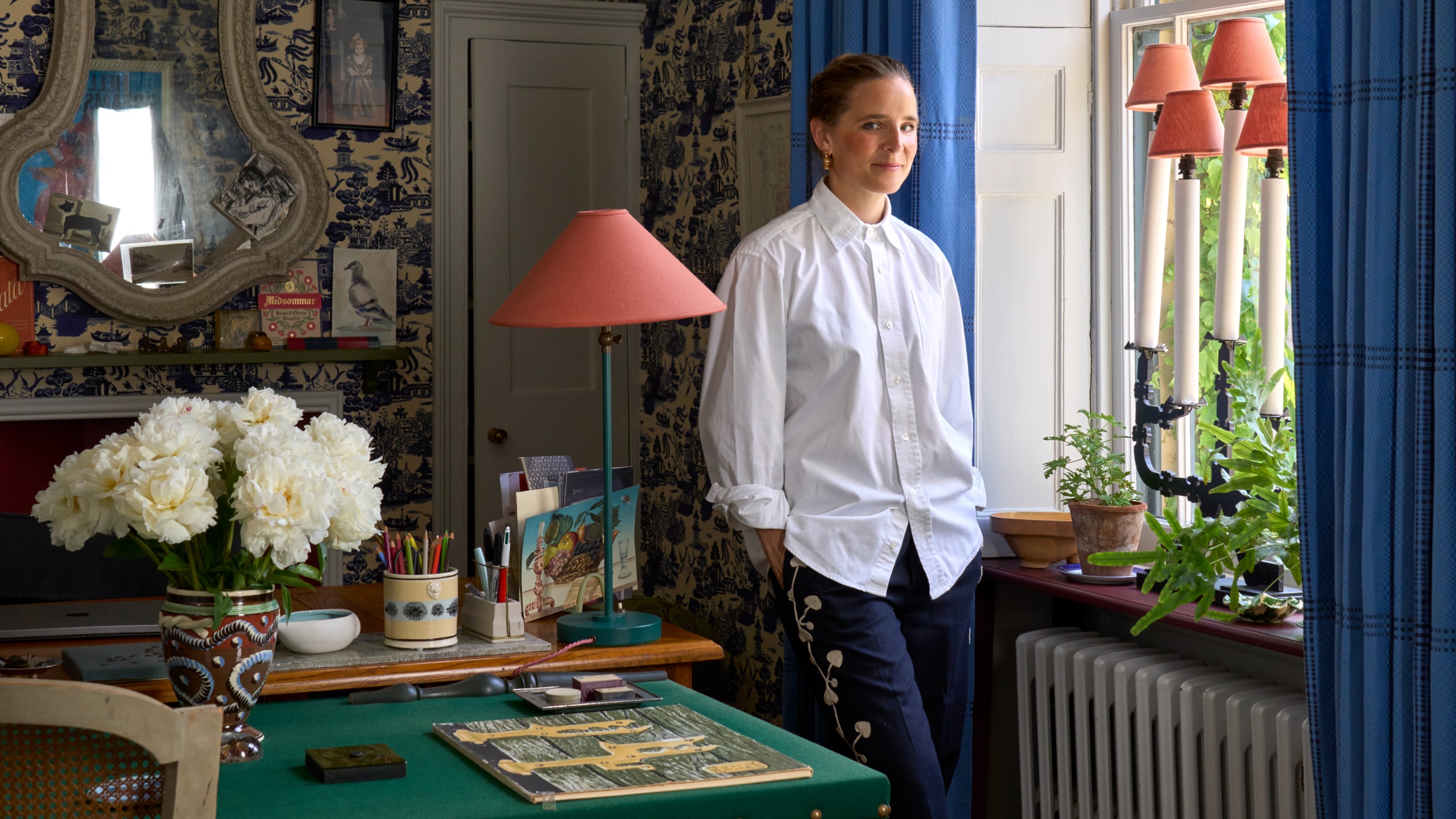 Beata Heuman standing in her home office
