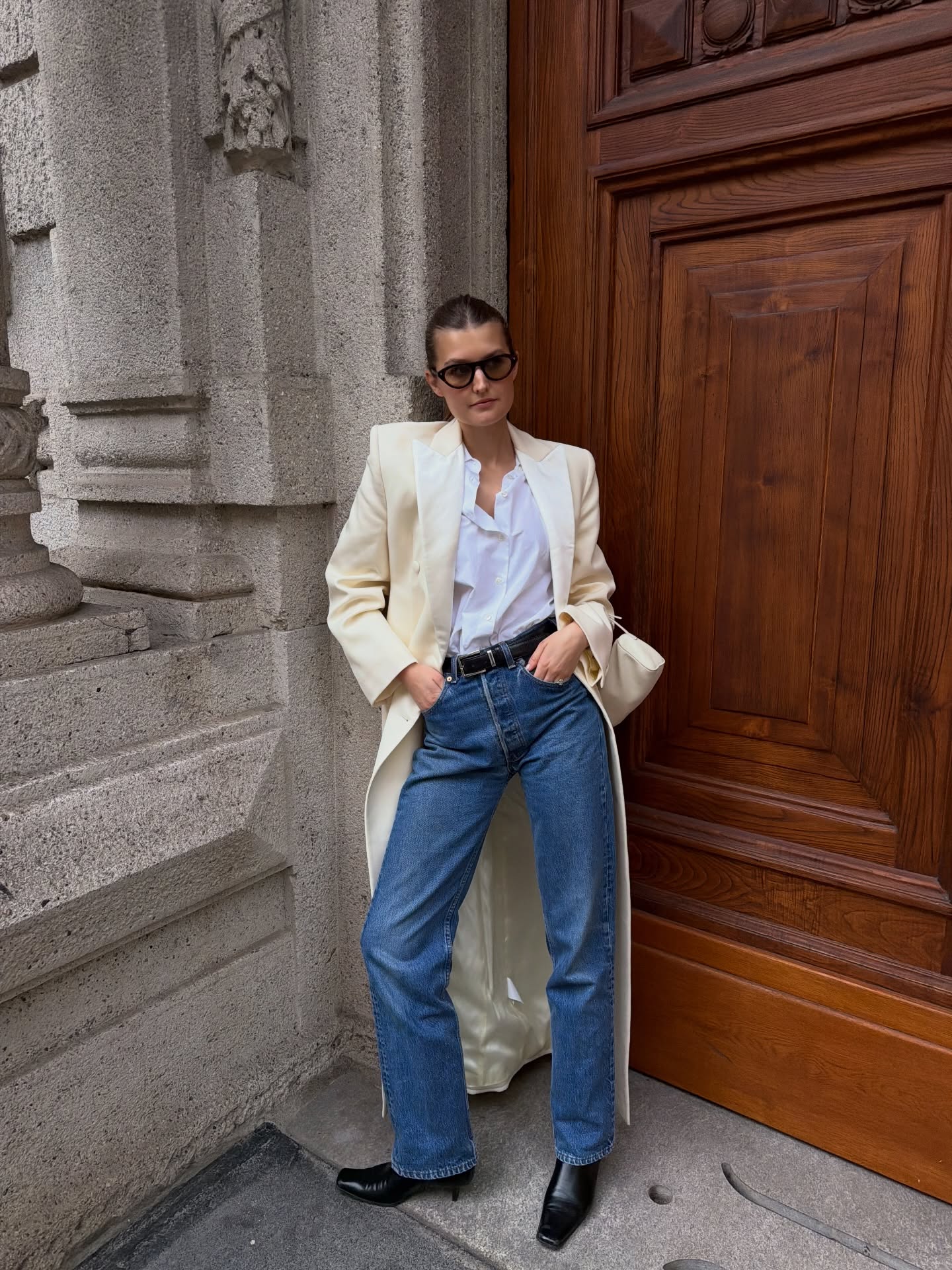 An image of a woman wearing fall boot trend with jeans 2026