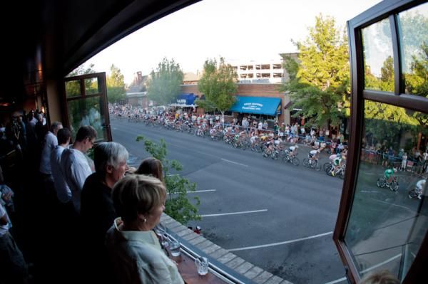 Fans at a wine bar enjoying the view of the race.