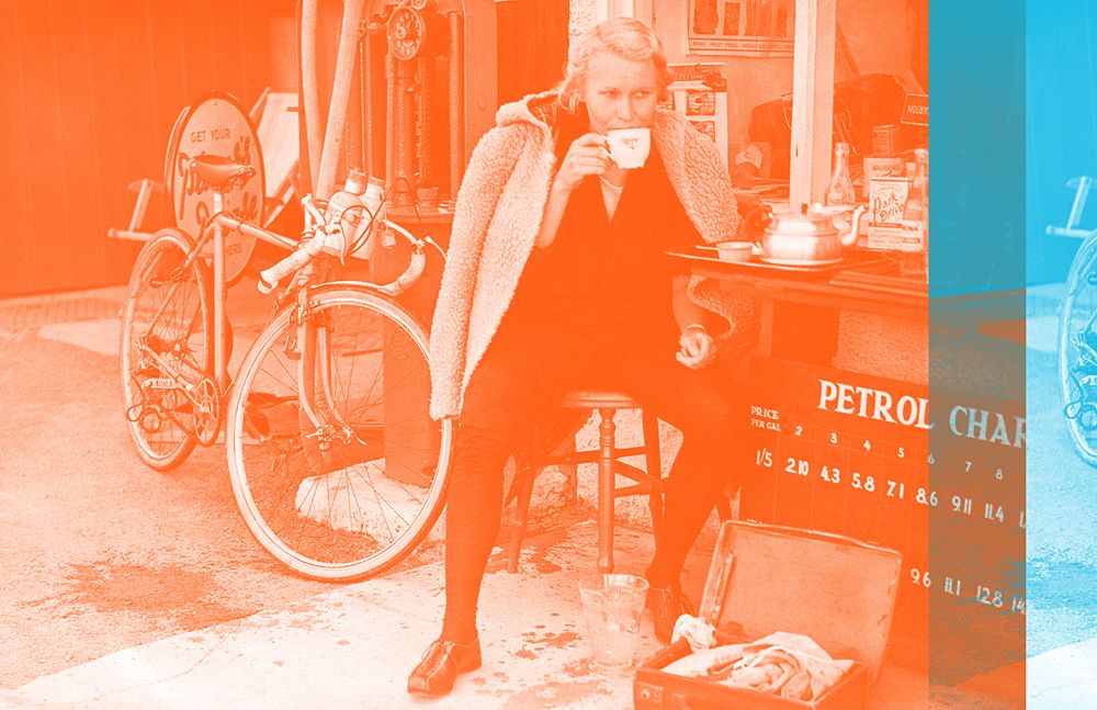 Marguerite Wilson sits with her bike on a tea break at Sticklepath village en route to John o' Groats