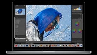 Product shot of MacBook Pro showing stylised image of woman wearing sunglasses and headscarf