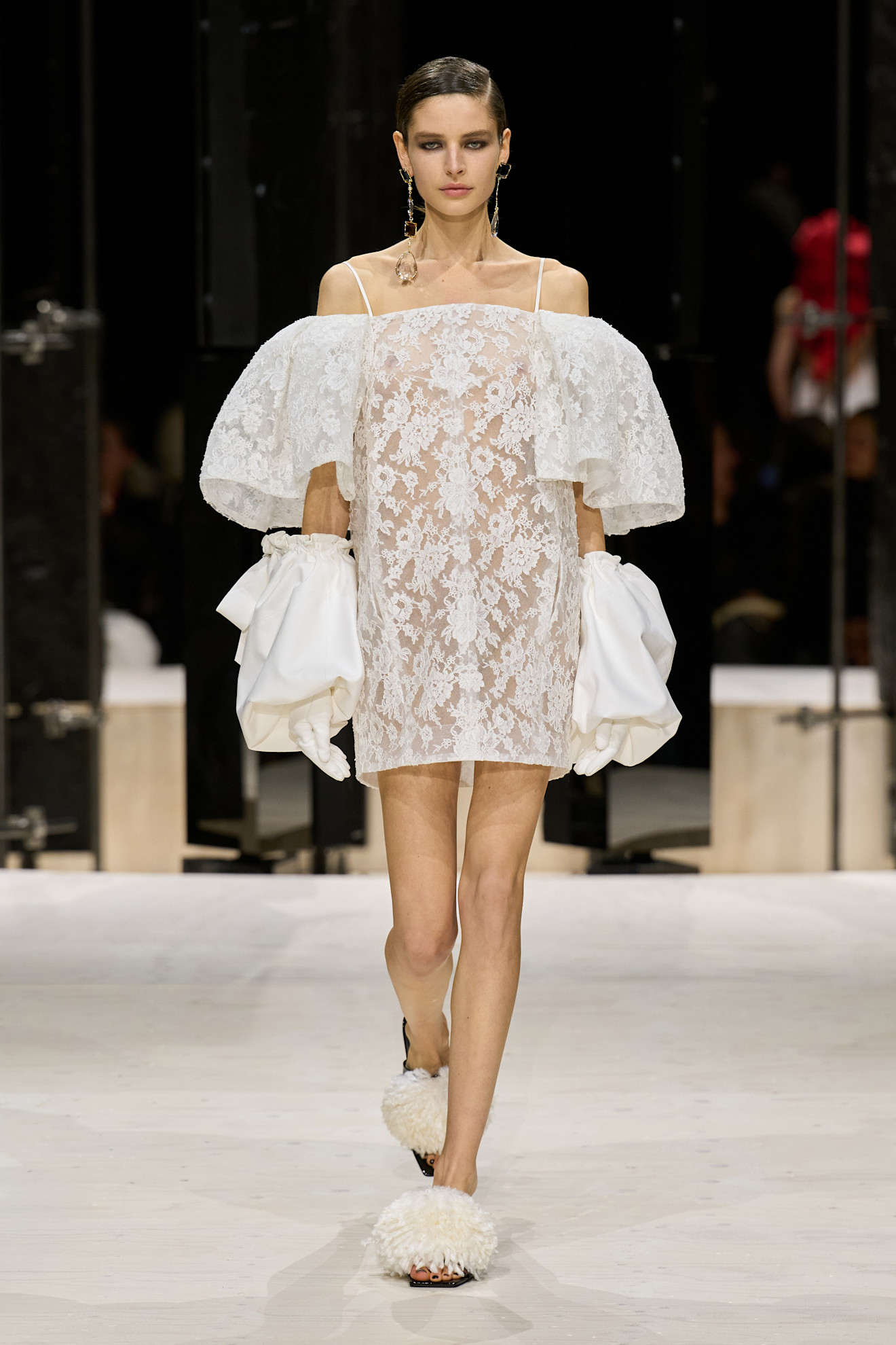 a model wears leopard a white lace dress