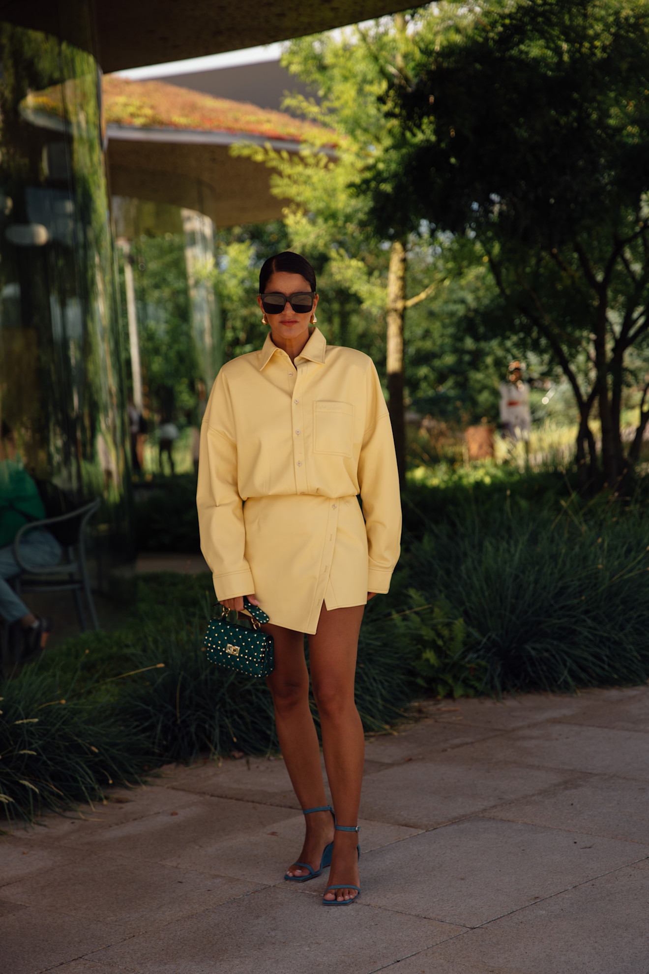 a woman in a butter yellow set during copenhagen fashion week