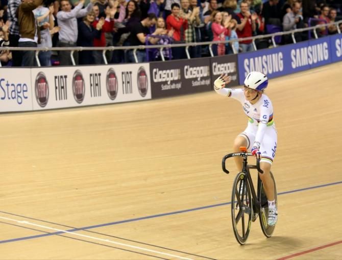 Britain's Laura Trott takes the applause after she won the women's Omnium elimination race.
