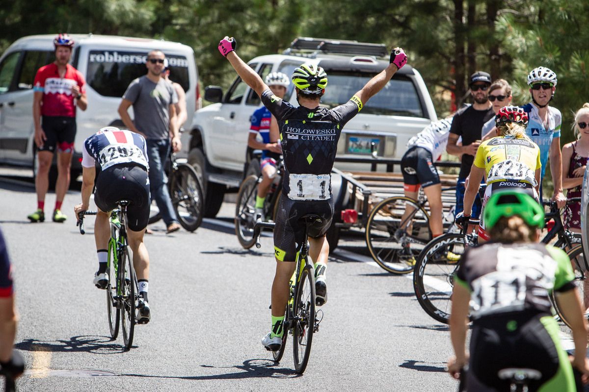 Alex Howes (USA) drops his head after taking the win as Rob Carpenter (Holowesko) celebrates winning the overall GC