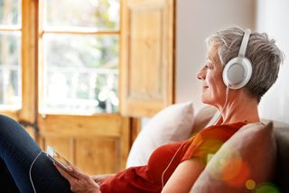 A woman listens to music