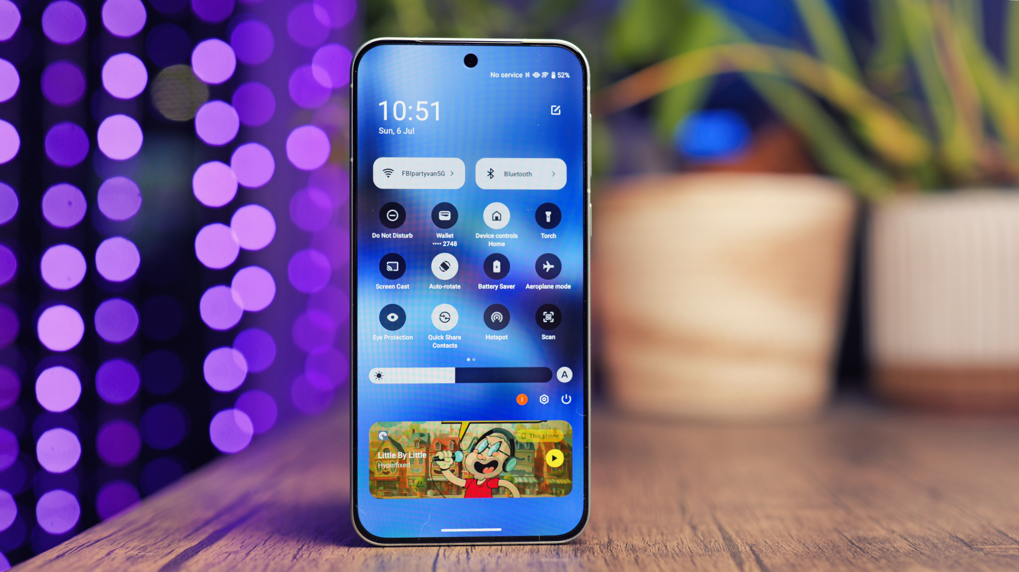 Vivo X200 FE phone on a wooden desk
