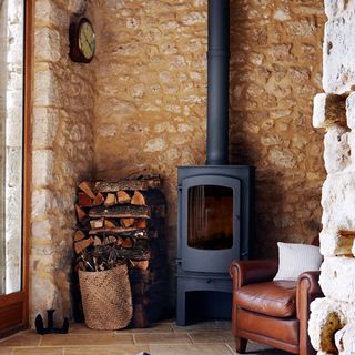 wood burning stove with chair and cushion