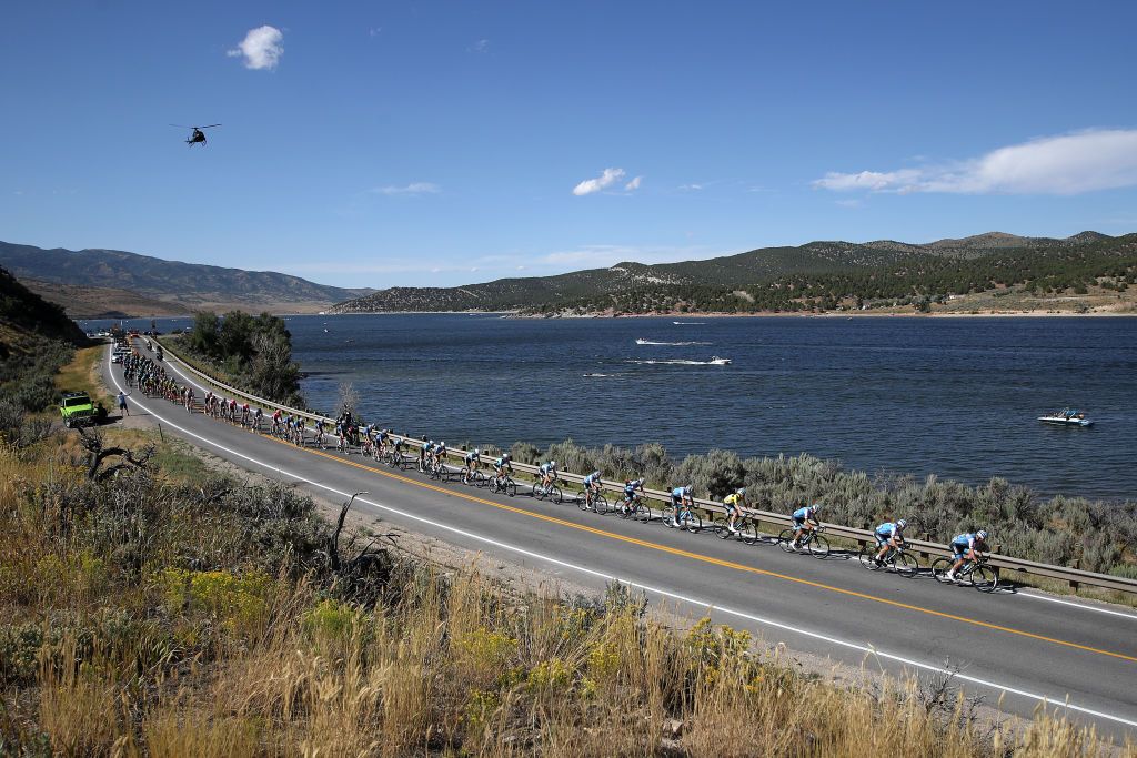 The peloton passes a lake during stage 5 at thee Tour of Utah