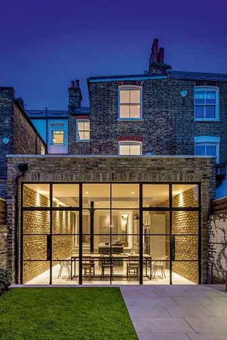 brick and glass rear extension to terrace house with view to kitchen