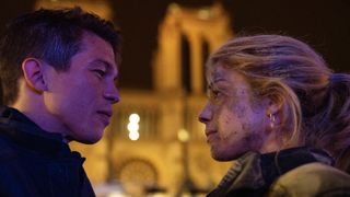 Sandor Funtek and Alice Isaaz look into one another's eyes in Notre-Dame