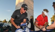 Mickelson and Langer signing flags