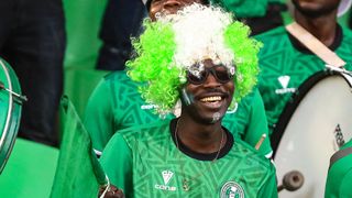 Nigeria fan in green and white wig at AFCON 2022
