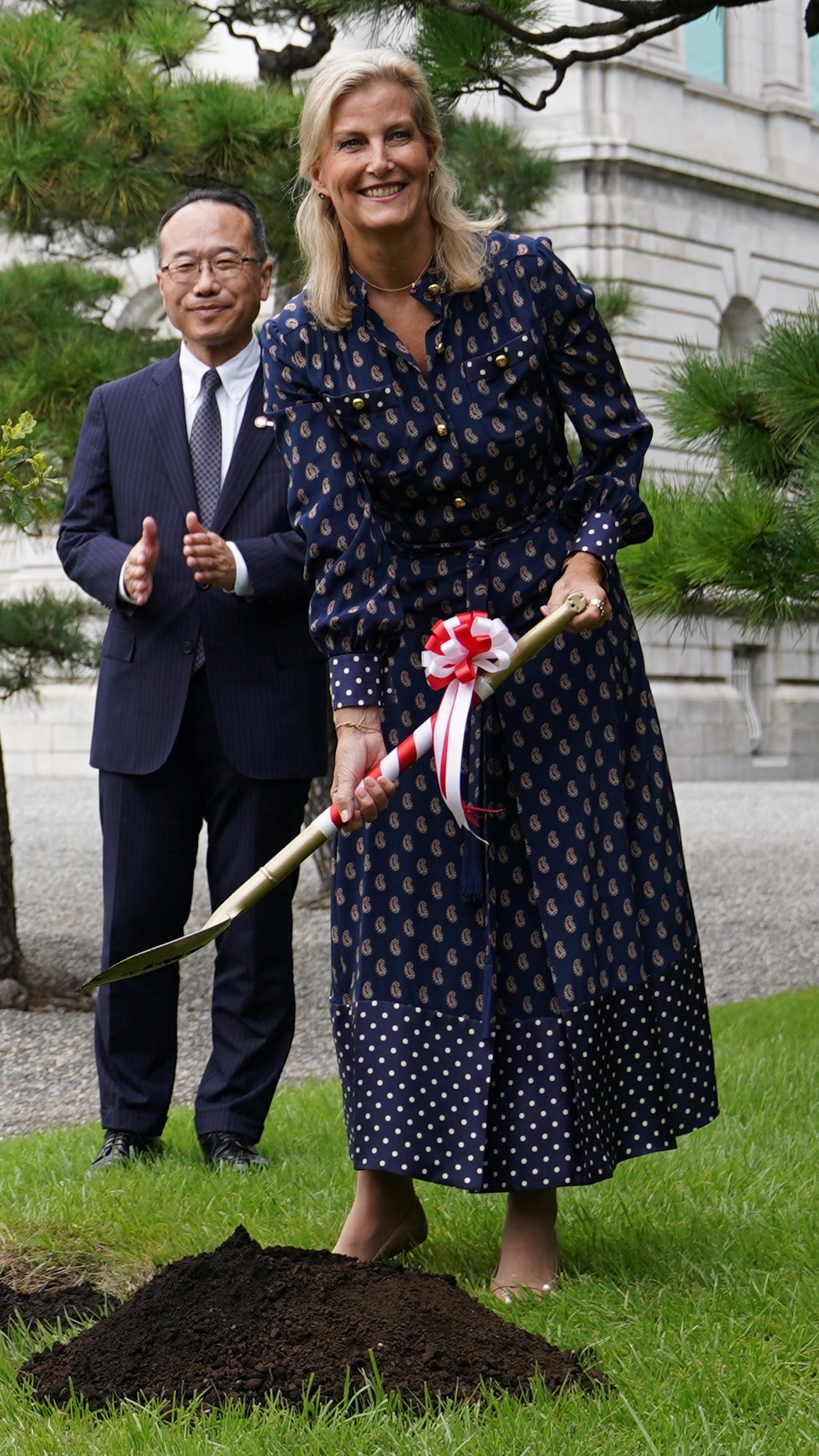 Sophie, Duchess of Edinburgh take part in a ceremonial planting of an oak sapling grown from the tree planted by late Queen Elizabeth II during her state visit to Japan
