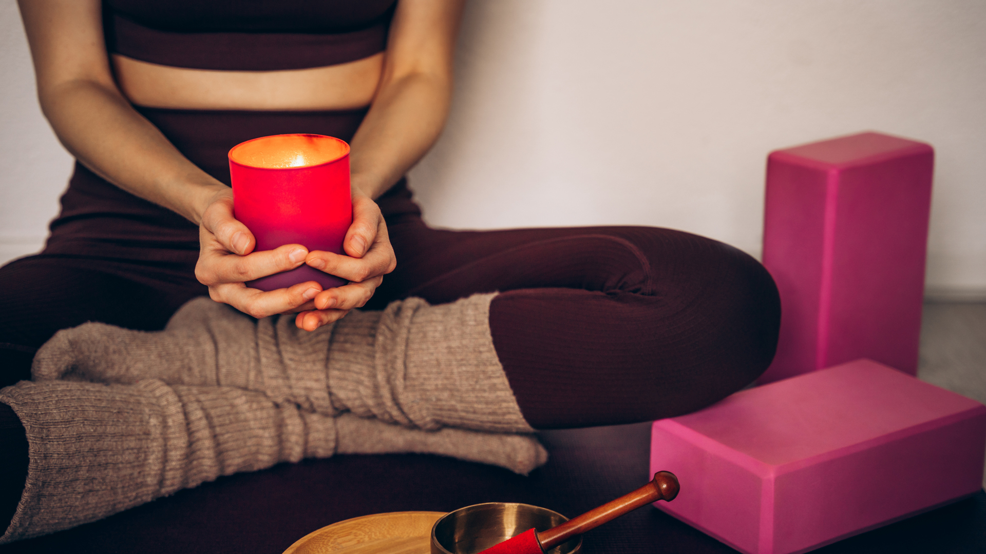 lady sitting with candle on the floor
