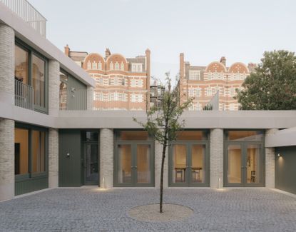 20 Newcourt Street, by Wendover, a london development of old and new with round columns and brick frontage