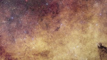 A glowing purple and gold starry deep space image