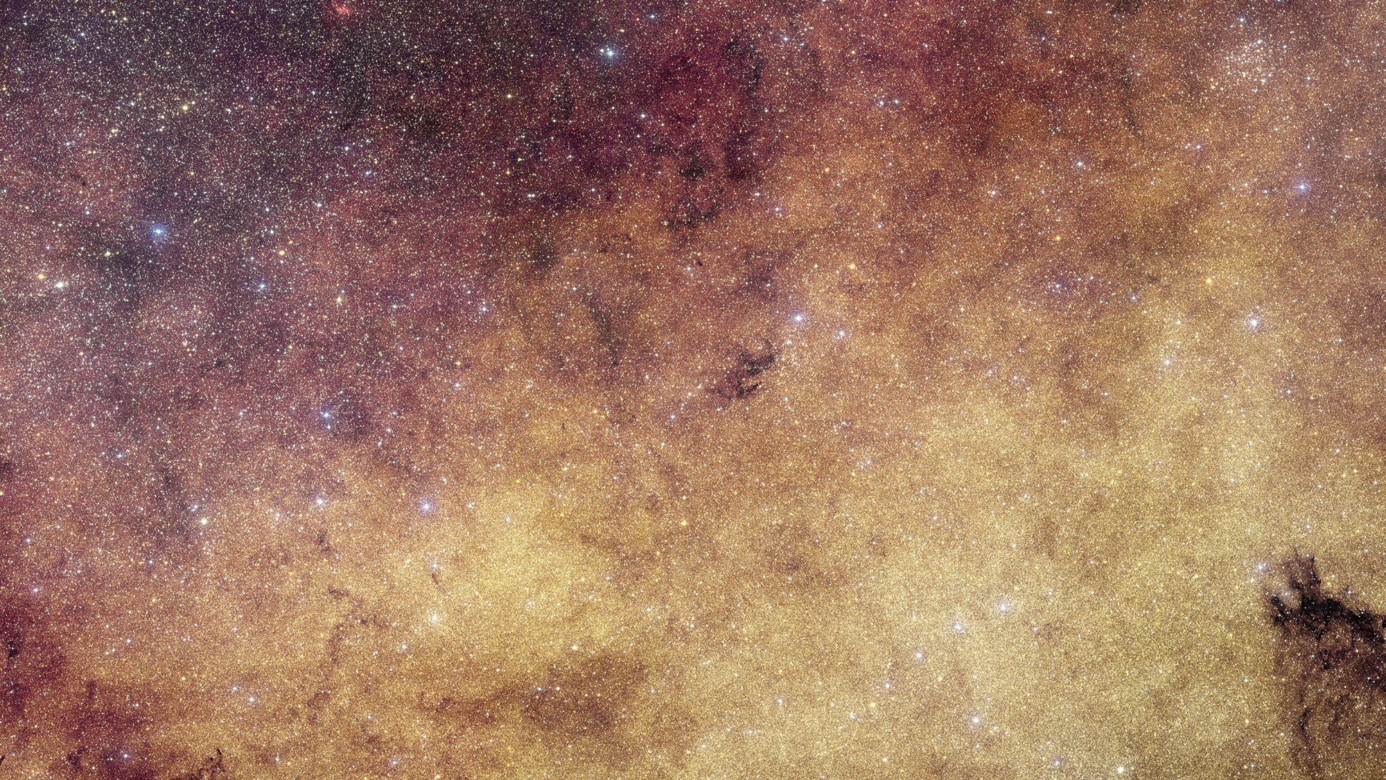 A glowing purple and gold starry deep space image