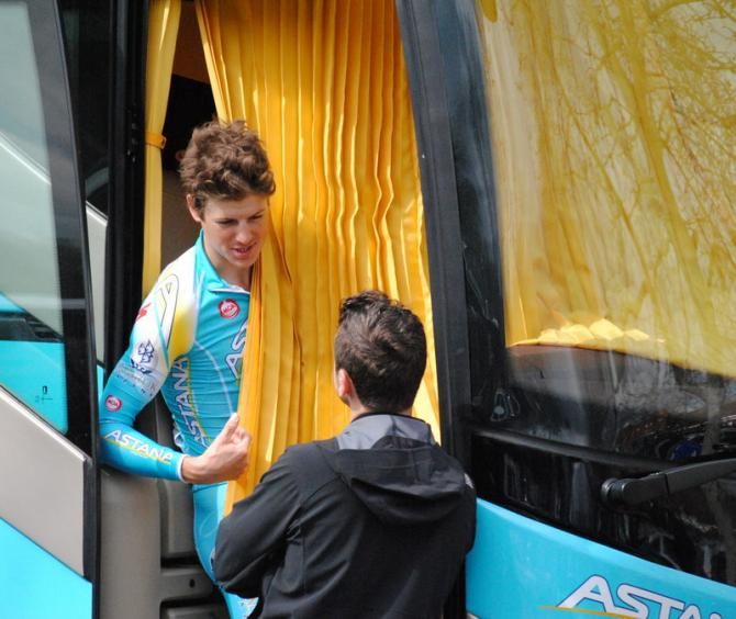 Jakob Fuglsang (Astana) talks to a friend from the team bus