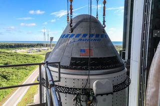The Boeing CST-100 Starliner spacecraft is secured atop a United Launch Alliance Atlas V rocket at the Vertical Integration Facility at Space Launch Complex 41 at Cape Canaveral Space Force Station in Florida, on July 17, 2021.