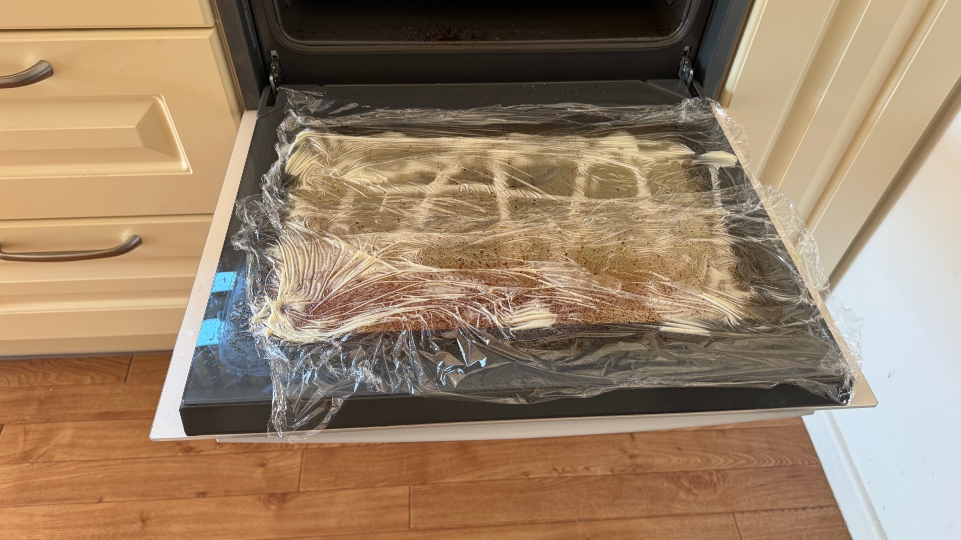Cling wrap and Cif on an oven door