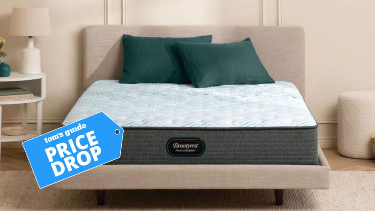 The image shows the Beautyrest PressureSmart mattress on a wooden bed frame with a Tom&#039;s Guide &#039;Price Drop badge overlaid