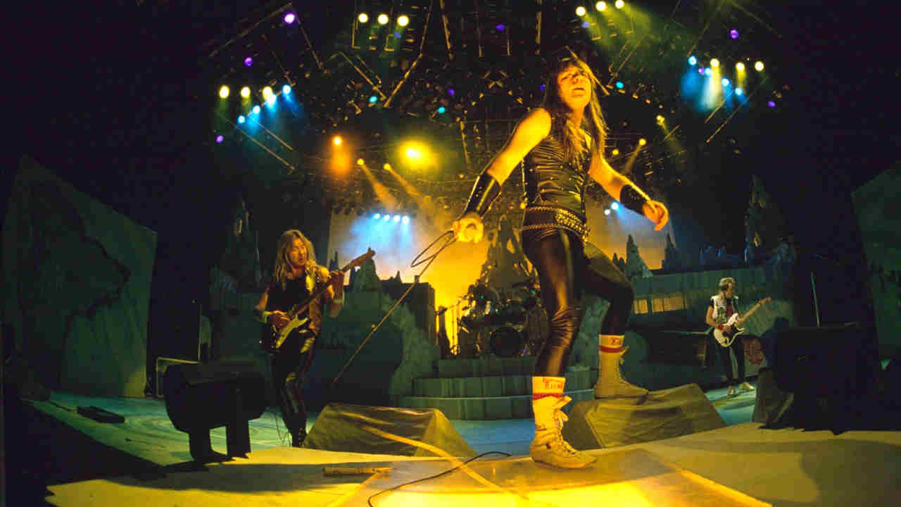 Iron Maiden performing onstage in the 1980s