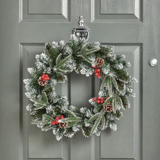 faux Christmas door wreath on a front door