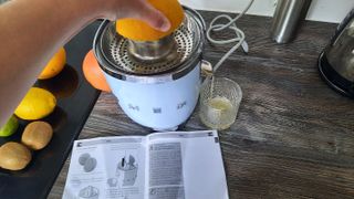 Smeg CJF01 citrus juicer juicing oranges