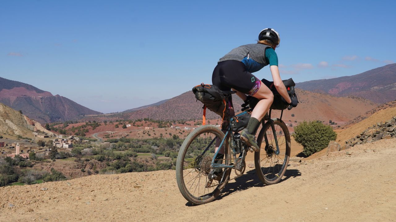 Anna Abram wearing some of the best women&#039;s gravel clothing on a bikepacking trip