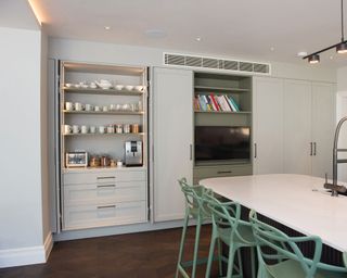 Coffee bar station within kitchen cabinet