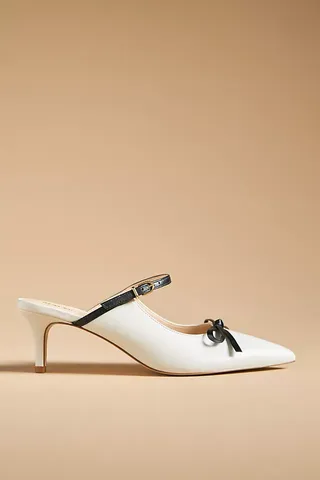 White Maeve Bow Kitten-Heel Mules with black bow and strap