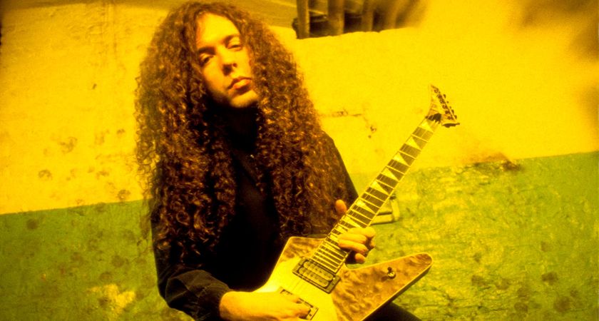 Marty Friedman with a figured-top Jackson guitar with a reverse headstock, circa &#039;90/&#039;91, in an image with a yellow filter shot with a bokeh effect