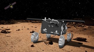 a small four-wheeled robotic rover on the surface of a red planet