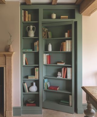 inbuilt blue bookcase that doubles up as secret door