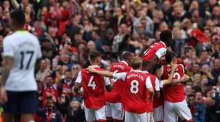 Arsenal players celebrate Thomas Partey's goal in the 3-1 win over Tottenham.