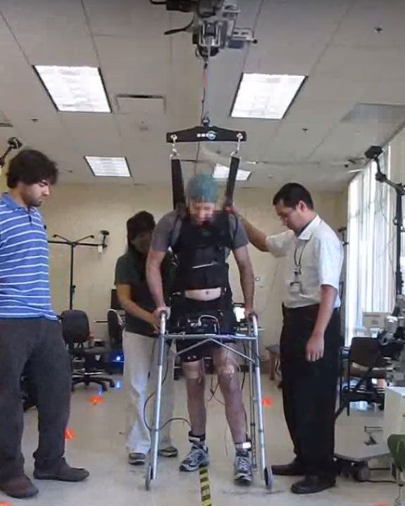 A man who was paralyzed in both legs for five years was able to use a brain-controlled system to walk again, along with a harness to help support his body weight.