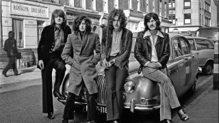 Led Zeppelin leaning on the bonnet of a Jaguar car in 1968